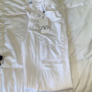 White flared ripped jeans